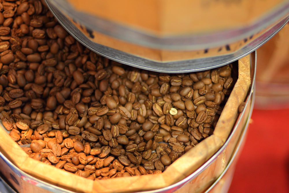 barrel full of aged coffee beans